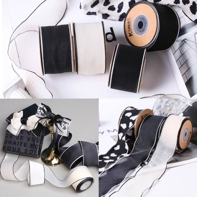 Harga yang bagus Sabuk Tekstil Salju Berwarna Hitam dan Putih Mengkilap dengan Kekuatan Tinggi 100m untuk Pita DIY Aksesori Rambut untuk Kotak Hadiah Kemasan Toko Bunga on line